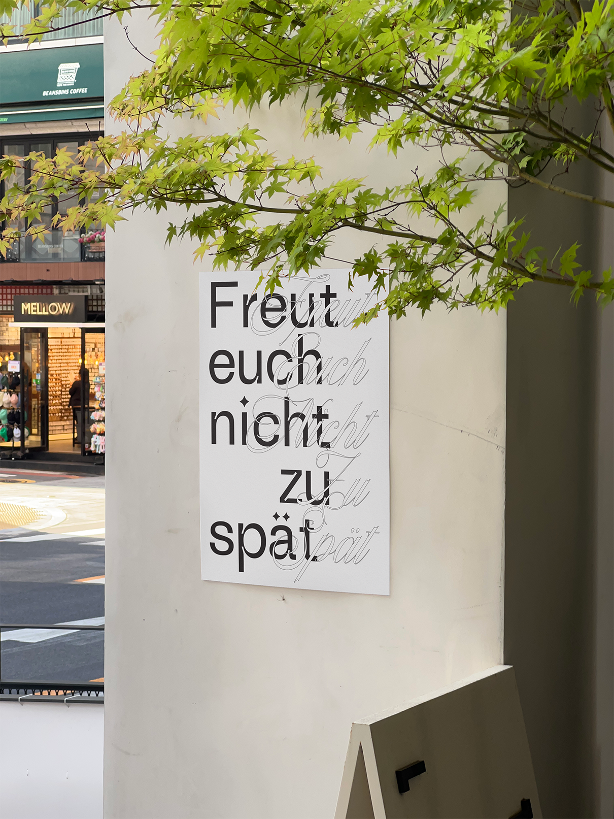 Freut euch nicht zu spät poster on a pillar